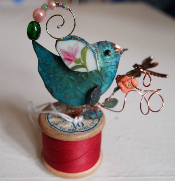 Small Bird on Cotton Reel
